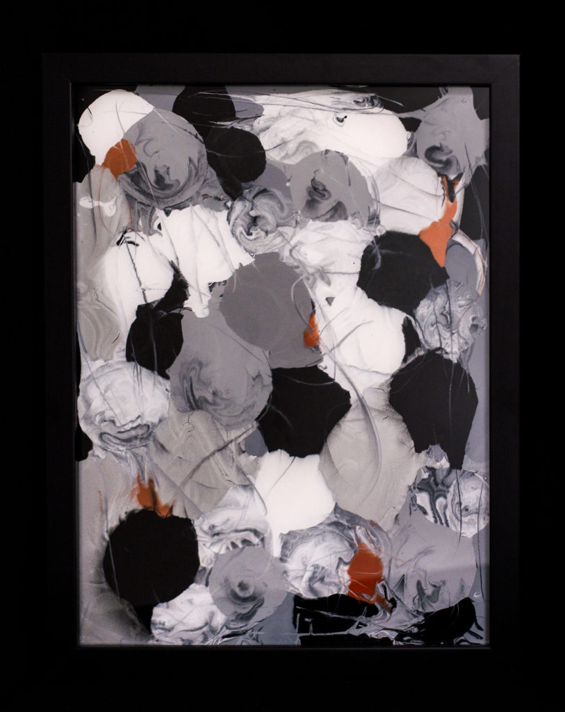 This painting on glass uses metallic colors of silvers, whites, grays, and rusts in abstract orb shapes.