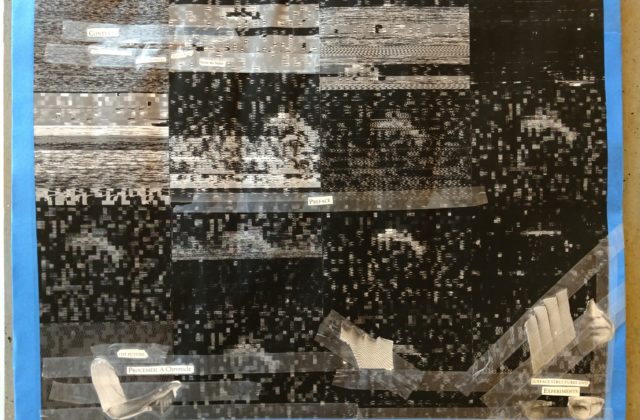 This work shows 16 black-and-white pixelated images overlaid with a poem made from words cut from newspapers.