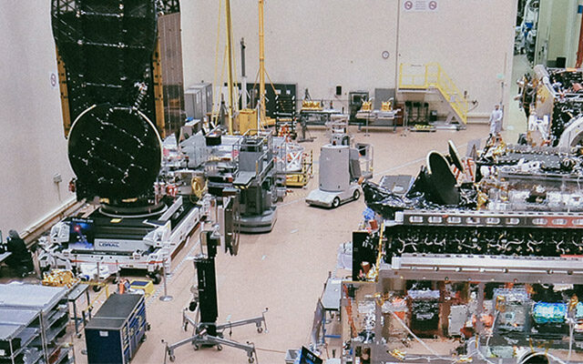 This image shows the high bay at Maxar where spacecraft are assembled.