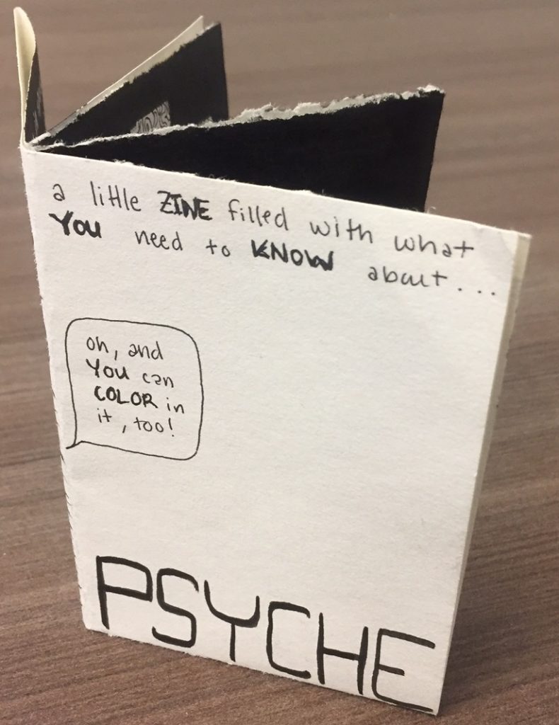 This image shows the Psyche zine folded up into an eight-page black and white miniature book.