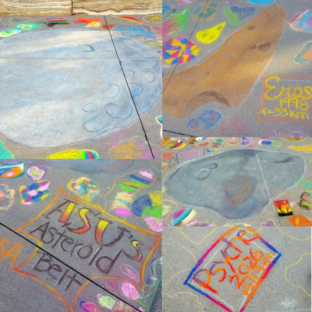 This photograph shows a number of asteroids drawn in chalk, including mini-asteroids decorated by public visitors.