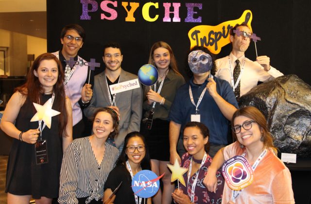 This image shows a subset of the Psyche Inspired interns in front of the Psyche Inspired Showcase photo booth.