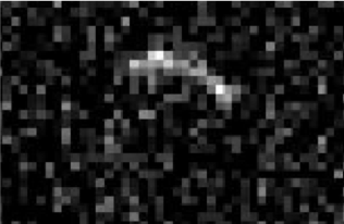 A pixelated black and white image of psyche the asteroid.