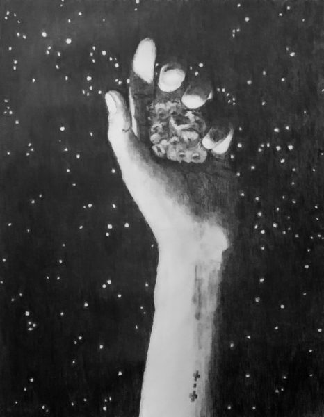 This graphite piece includes a black background with small glistening stars. From the bottom of the image, a human arm with a small tattoo of the Psyche spacecraft protrudes and loosely grasps the asteroid. The sun, which is out of frame, casts light onto some parts of the arm and asteroid while other parts remain coated in dark shadows.