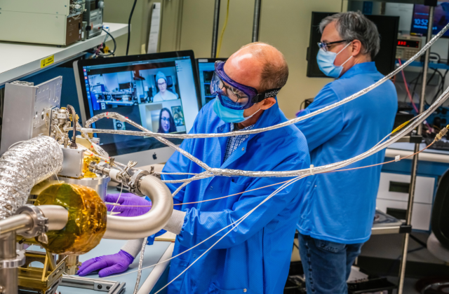 Engineers at the Johns Hopkins Applied Physics Laboratory in Laurel, Maryland, make progress on the spectrometer for NASA's Psyche spacecraft, while observing COVID-19 safety procedures.