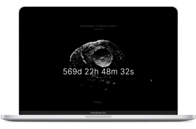On a computer screen, a model of the Psyche asteroid is displayed in the center. Over the asteroid is a timer, counting down the days, hours, minutes, and seconds until the launch. As you scroll down, the Psyche asteroid rotates and moves to the left, revealing text that describes the current mission phase and link to learn more.