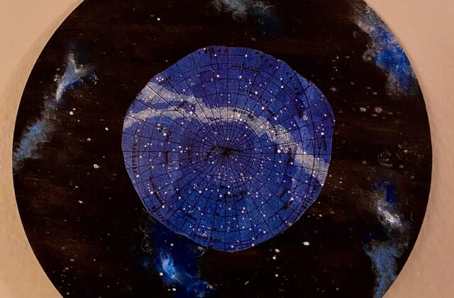 Psyche and the Night Sky is created on a circular wooden panel with acrylic paint. The background is the night sky with blue nebulas floating around Psyche, which is cut out of a constellation map.
