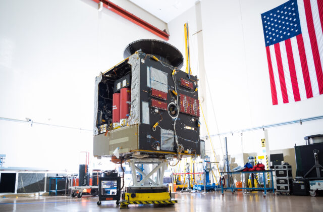 This image is of the main body of the spacecraft (the bus) in a factory space.