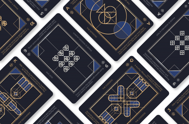 This deck of cards is designed to emulate the theorized texture and color of the asteroid. The card background is a navy blue, and the supporting design elements are gold, silver, royal blue, and dark blue. The diamond and heart suits are silver, whereas the club and spade cards are gold. Each design element follows an art deco aesthetic and consists of outlined geometric shapes and sharp edges with thick and thin lines that are gold or silver. Fun facts are found at the top and bottom of the cards with dates and titles found on the sides.
