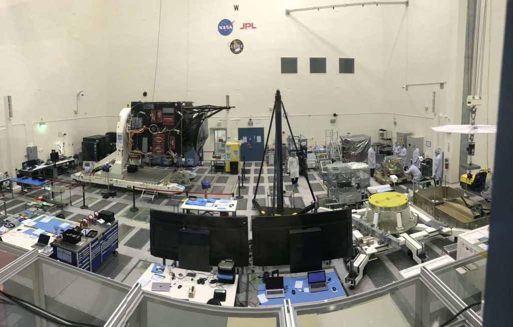 panoramic view of JPL's High Bay 2 area filled with technical equipment and some engineers